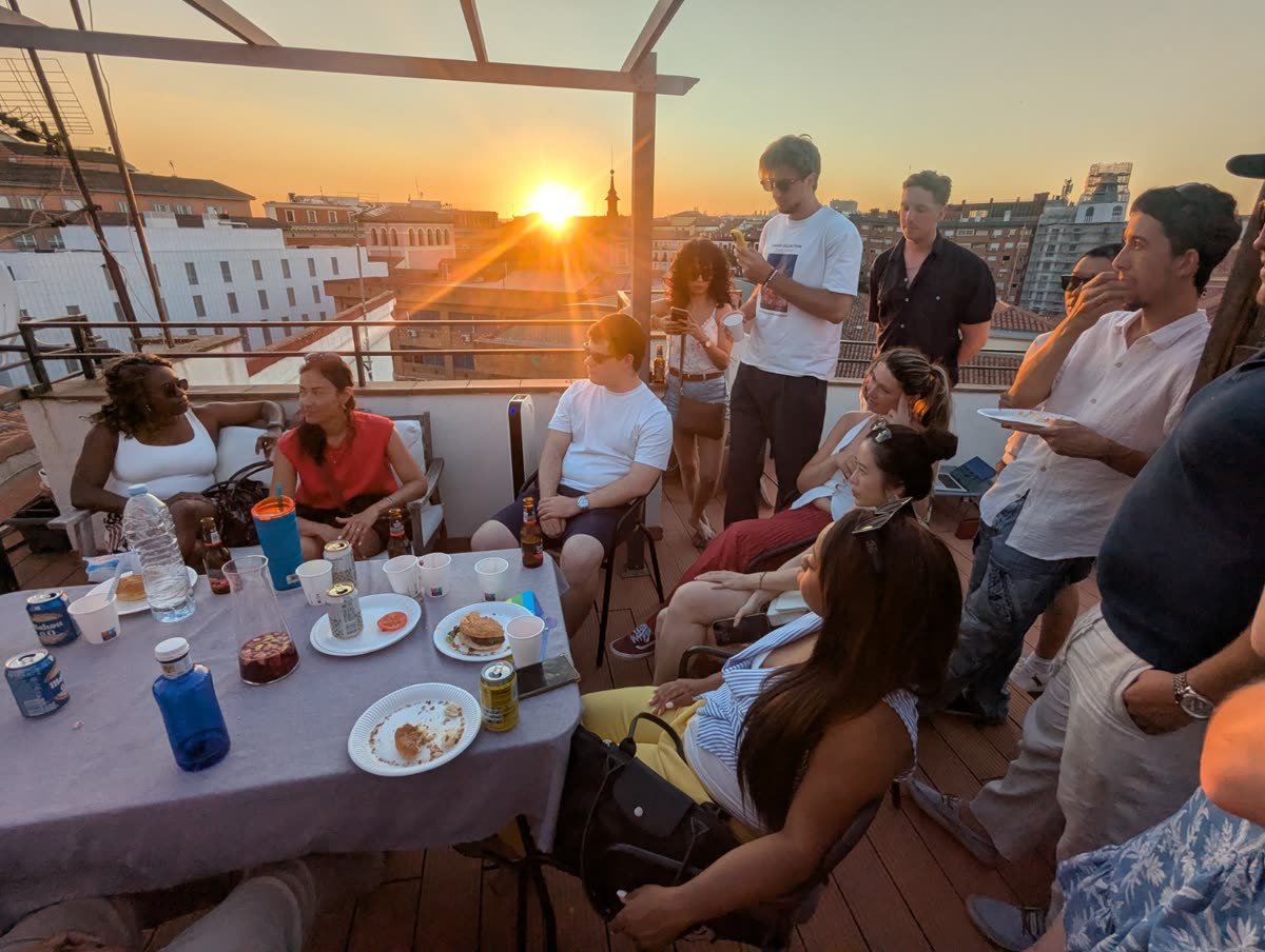 An evening event on a Madrid rooftop at sunset